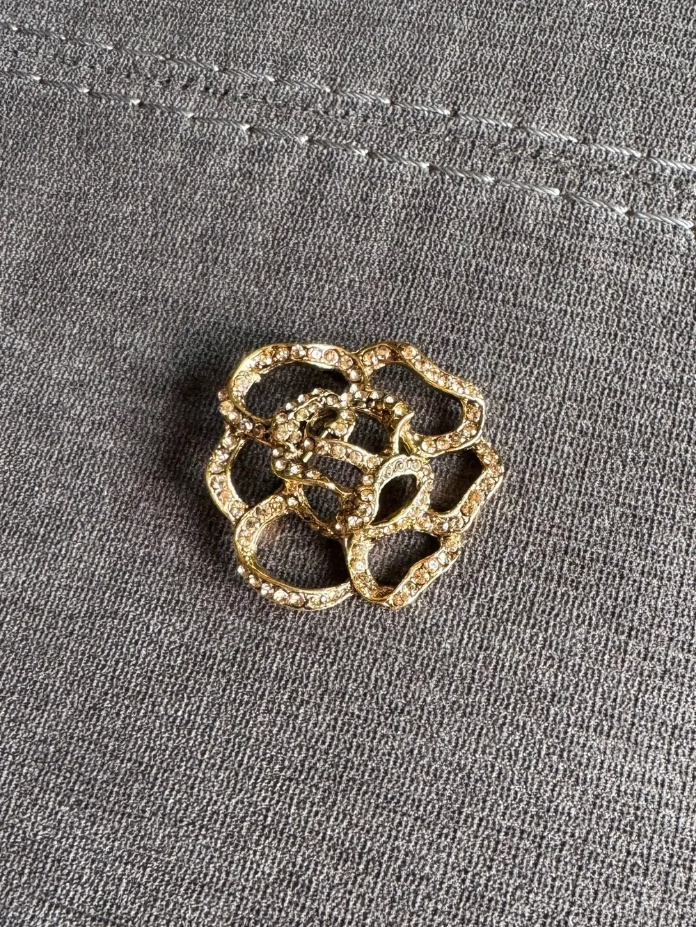 Gold brooche with rhinestones